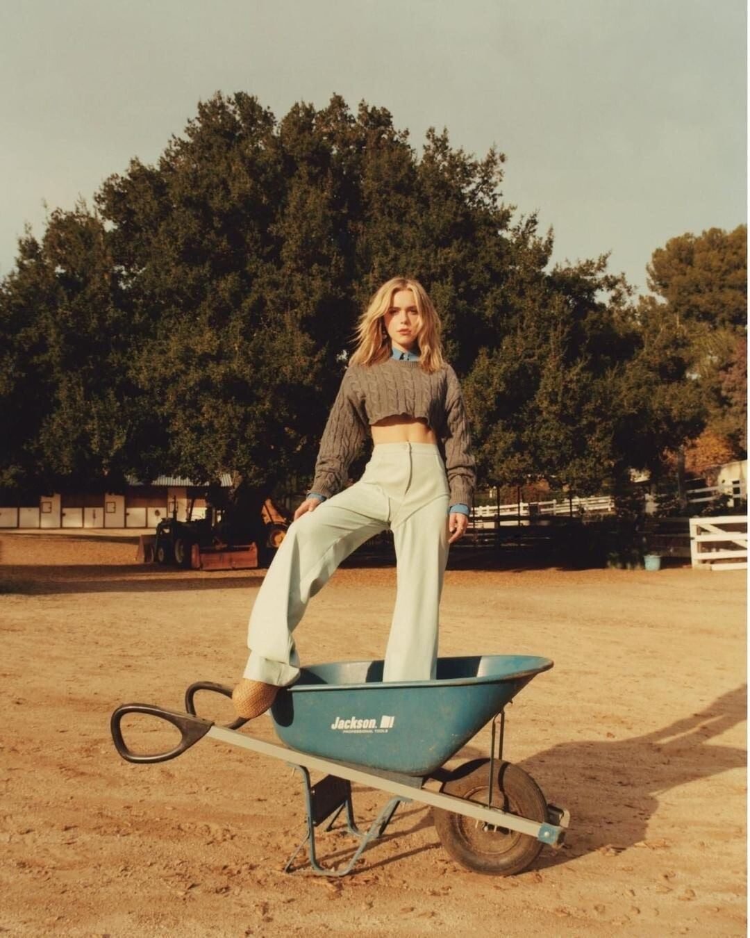 Fashion editorial in the riding arena with a wheelbarrow prop, Shadow Hills Ranch